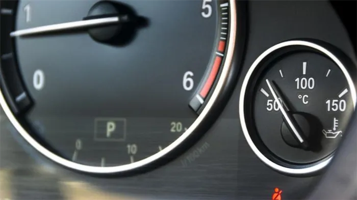 Coolant temperature gauge and tahometer on a car
